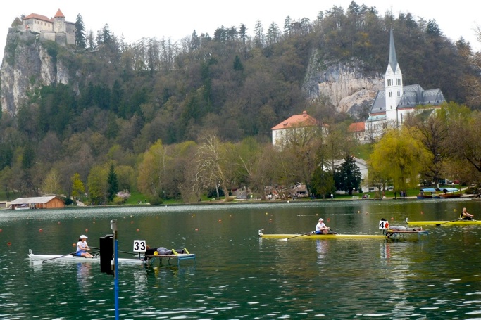 Beautiful Lake Bled with competitive rowers