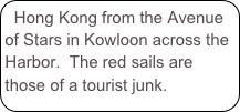 Hong Kong from the Avenue of Stars in Kowloon across the Harbor.  The red sails are those of a tourist junk.